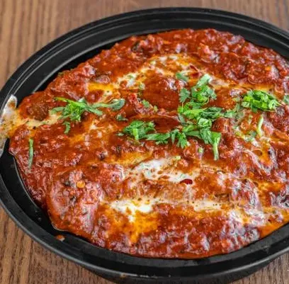 Baked cheese and tomato dish at Melita Restaurant and Bar in Melita, MB